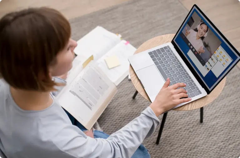 Woman working through an online course on a laptop